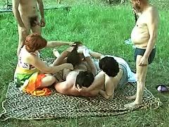 Outdoor gangbang with horny granny