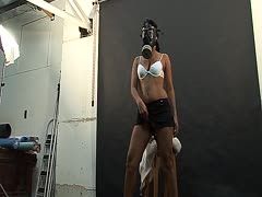 Sex model poses with gas mask